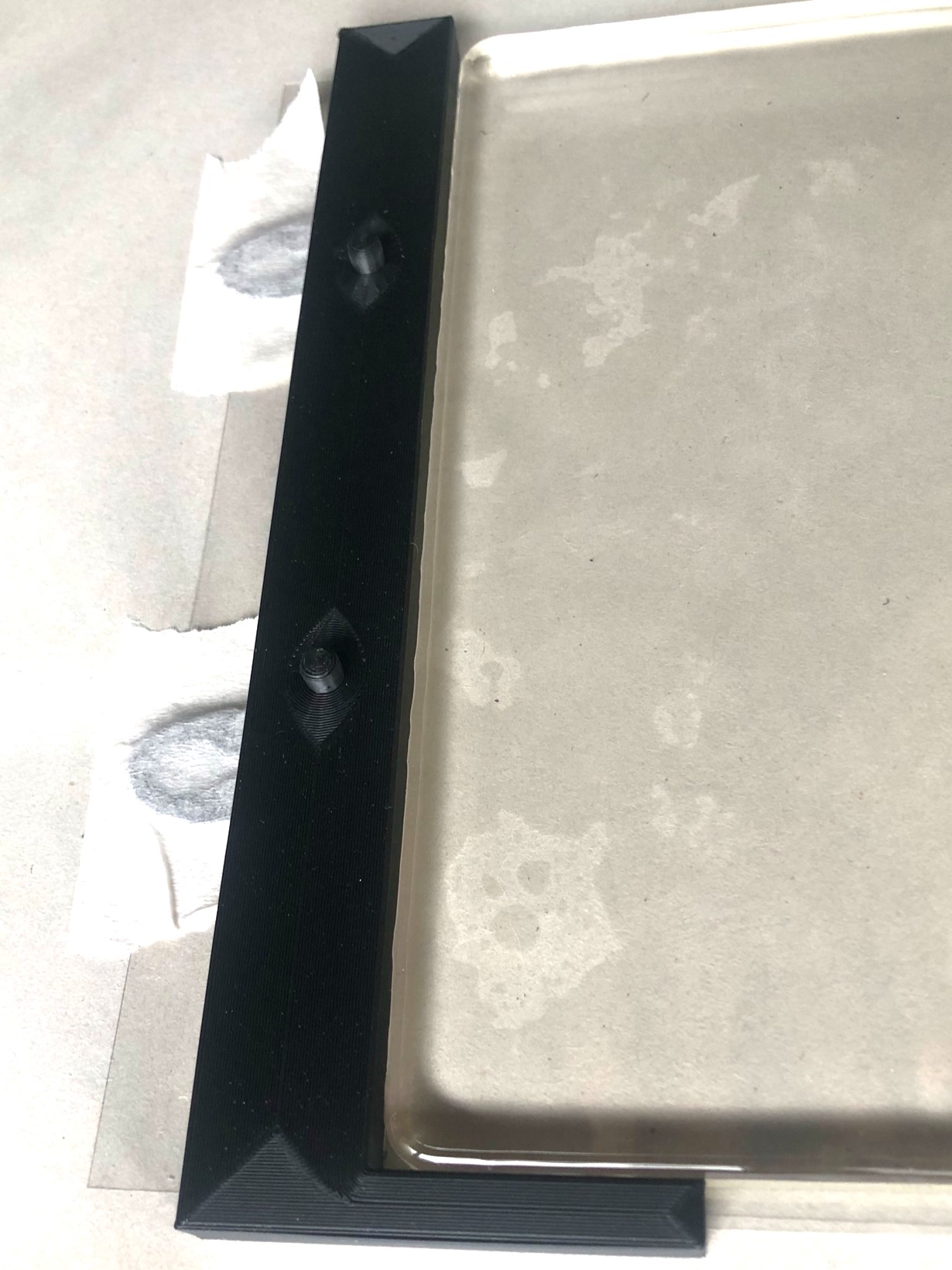 Black gel plate registration board, taped down to work surface with Gelli plate